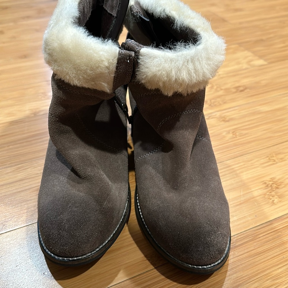 Taupe/gray boot with about a 2.5 inch heel in perfect condition. Worn 1 time.